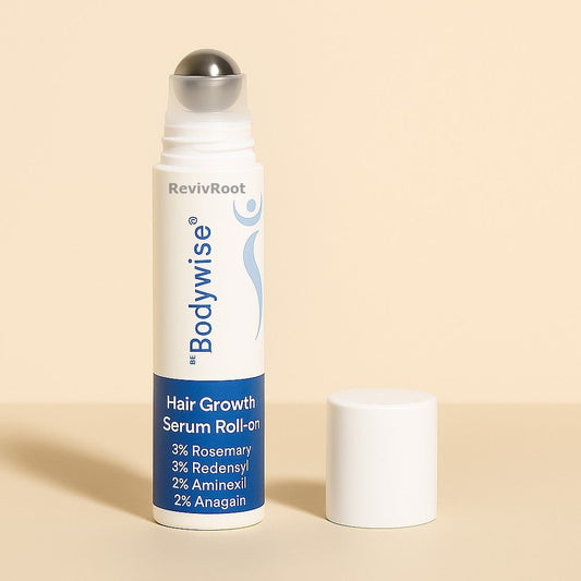 RevivRoot Bodywise Hair Growth Serum Roll-on on a beige background